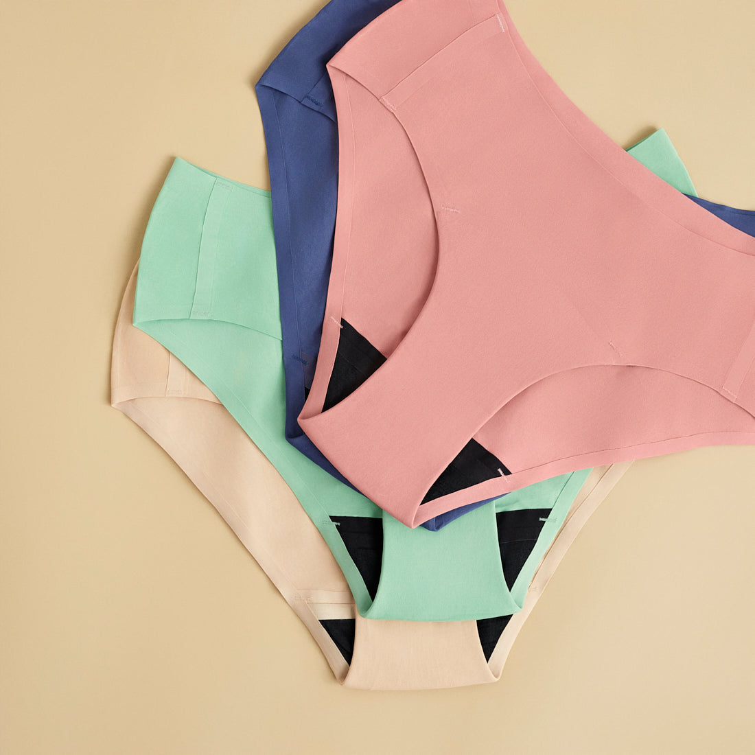 nahtlose Perioden Slips in blau, rosa, sage und beige