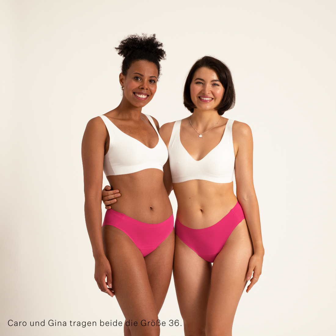 Zwei Models tragen ooia Slip Seamless in hot pink - nahtloser Periodenslip.