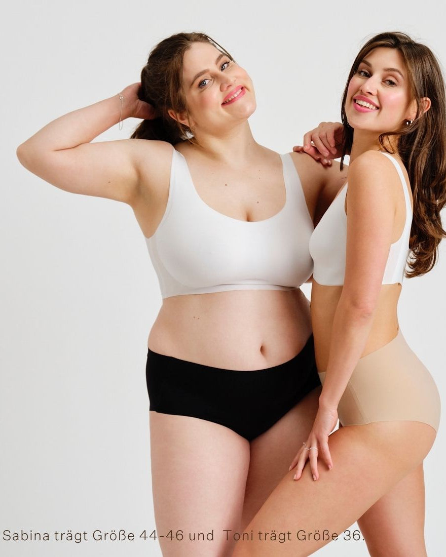 Zwei Models unterschiedlicher Konfektion tragen Modell ooia everyday Highwaist Seamless in Beige & Schwarz – nahtlose Unterwäsche mit hohem Bund, die Slipeinlagen ersetzt