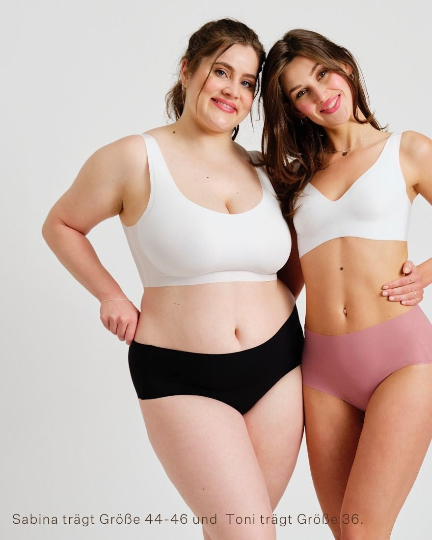Zwei Models unterschiedlicher Konfektion tragen ooia everyday Highwaist Seamless in Dusky Pink & Schwarz – nahtlose Unterwäsche mit hohem Bund, die Slipeinlagen ersetzt.