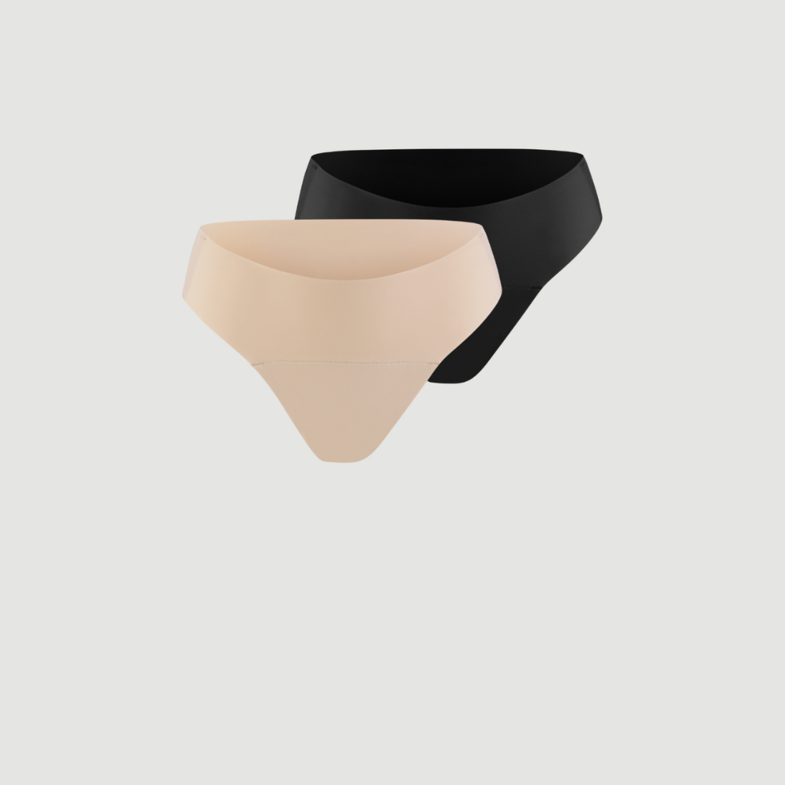 ooia everyday Slip Seamless in Schwarz und Beige – nahtlose Unterwäsche, die Slipeinlagen ersetzt.